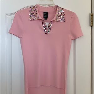 Pink knit tee with sequins.